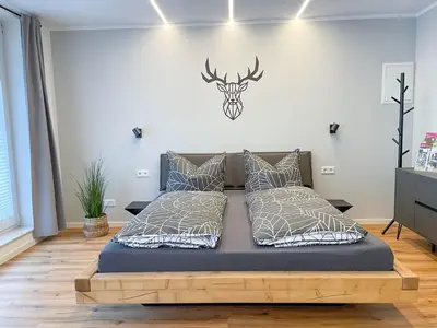 Ein Bett oder Betten in einem Zimmer der Unterkunft Appartement am Mythenweg