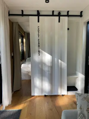 Ein Bett oder Betten in einem Zimmer der Unterkunft Cozy Cabins I Tiny House Seecontainer