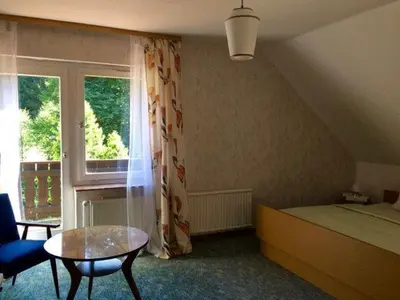 Ein Bett oder Betten in einem Zimmer der Unterkunft Ferienwohnung Momo . Villa Strawalde . Altenau/Oberharz