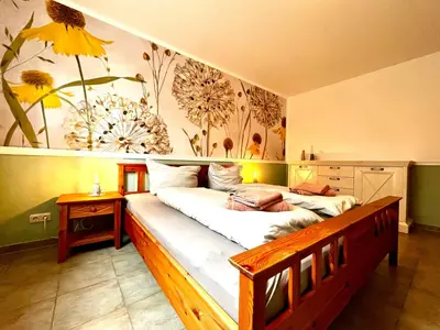 Ein Bett oder Betten in einem Zimmer der Unterkunft Ferienwohnung Waldliebe