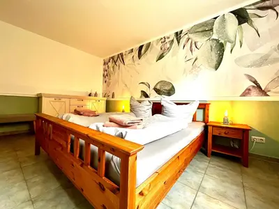 Ein Bett oder Betten in einem Zimmer der Unterkunft Ferienwohnung Waldliebe