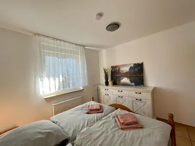 Ein Bett oder Betten in einem Zimmer der Unterkunft Ferienwohnung Wanderkönig mit Terrasse