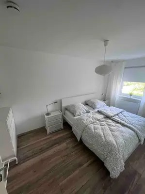 Ein Bett oder Betten in einem Zimmer der Unterkunft Wohnung Julie