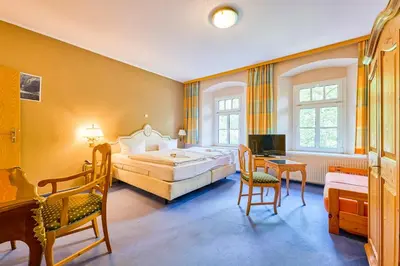 Ein Bett oder Betten in einem Zimmer der Unterkunft Hotel Bodeblick