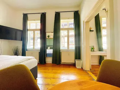 Ein Bett oder Betten in einem Zimmer der Unterkunft Fachwerkträume - 35m² Weltkulturerbe