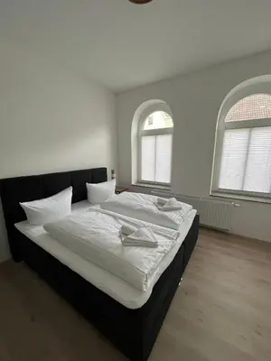 Ein Bett oder Betten in einem Zimmer der Unterkunft Altstadtliebe
