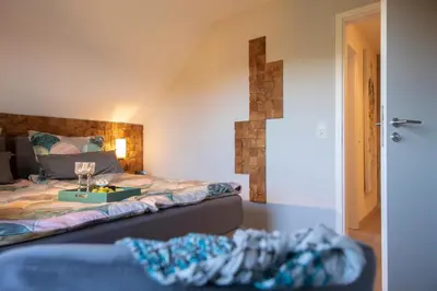 Ein Bett oder Betten in einem Zimmer der Unterkunft Premium-Plus-Ferienhaus Skadi II
