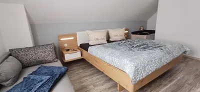 Ein Bett oder Betten in einem Zimmer der Unterkunft Premiumferienhaus Surya