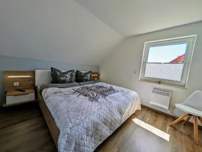 Ein Bett oder Betten in einem Zimmer der Unterkunft Premiumferienhaus Mara