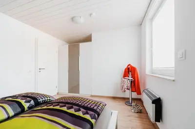 Ein Bett oder Betten in einem Zimmer der Unterkunft Ferienhaus Arisa I