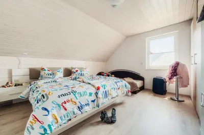 Ein Bett oder Betten in einem Zimmer der Unterkunft Ferienhaus Arisa III