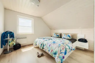 Ein Bett oder Betten in einem Zimmer der Unterkunft Ferienhaus Arisa III