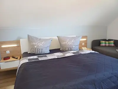 Ein Bett oder Betten in einem Zimmer der Unterkunft Ferienhaus Kari