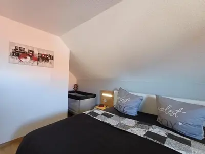 Ein Bett oder Betten in einem Zimmer der Unterkunft Ferienhaus Kari