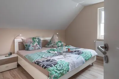 Ein Bett oder Betten in einem Zimmer der Unterkunft Ferienhaus Asgard