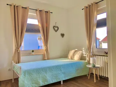 Ein Bett oder Betten in einem Zimmer der Unterkunft Ferienwohnungen Am Klusteich