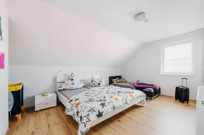 Ein Bett oder Betten in einem Zimmer der Unterkunft Ferienhaus Hödur