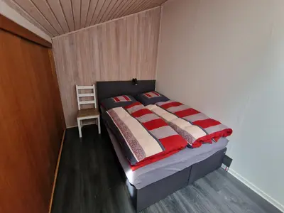Ein Bett oder Betten in einem Zimmer der Unterkunft gemütliche moderne Ferienwohnung inkl. WLAN in St Andreasberg/Braunlange