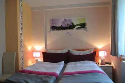 Ein Bett oder Betten in einem Zimmer der Unterkunft Ferienwohnungen Treseburg 