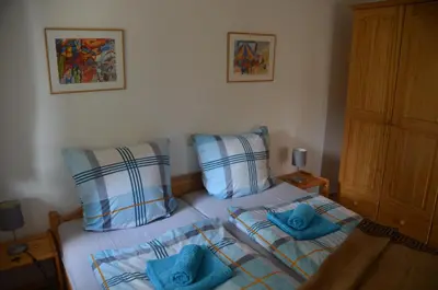 Ein Bett oder Betten in einem Zimmer der Unterkunft Ferienwohnung Sonnenblume