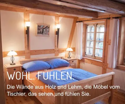 Ein Bett oder Betten in einem Zimmer der Unterkunft Ferienwohnung direkt Am kleinsten Haus in Wernigerode