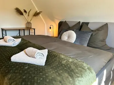 Ein Bett oder Betten in einem Zimmer der Unterkunft Harzburgliving Wohnung Goethe`s Auszeit