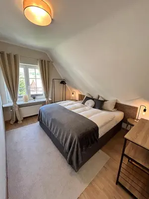 Ein Bett oder Betten in einem Zimmer der Unterkunft Harzburgliving Wohnung Goethe`s Auszeit