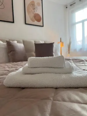 Ein Bett oder Betten in einem Zimmer der Unterkunft Ferienwohnung Grüne Straße 1
