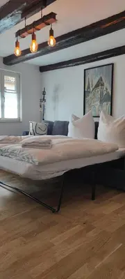 Ein Bett oder Betten in einem Zimmer der Unterkunft Ferienhaus Harztörchen