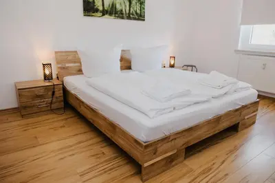 Ein Bett oder Betten in einem Zimmer der Unterkunft Ferienwohnung Spatzennest