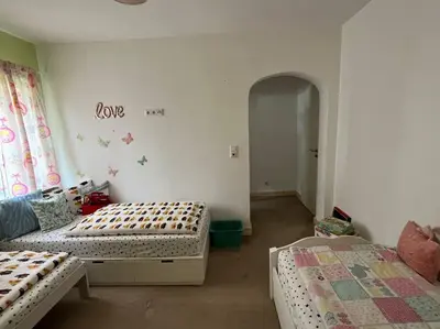 Ein Bett oder Betten in einem Zimmer der Unterkunft Exklusive Ferienwohnung mit 3 Schlafzimmern und 2 Bädern!