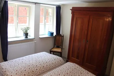 Ein Bett oder Betten in einem Zimmer der Unterkunft Ferienwohnungen Im Alten Handelshof
