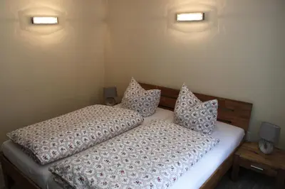 Ein Bett oder Betten in einem Zimmer der Unterkunft Ferienwohnungen Im Alten Handelshof