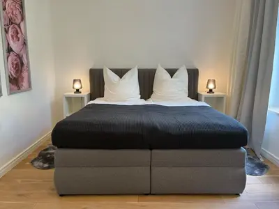 Ein Bett oder Betten in einem Zimmer der Unterkunft Prinzenhof Suite