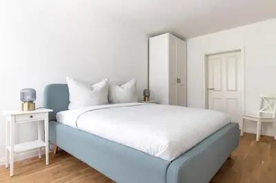 Ein Bett oder Betten in einem Zimmer der Unterkunft Ferienhaus im Altstadtgässchen mit 3 Badezimmern