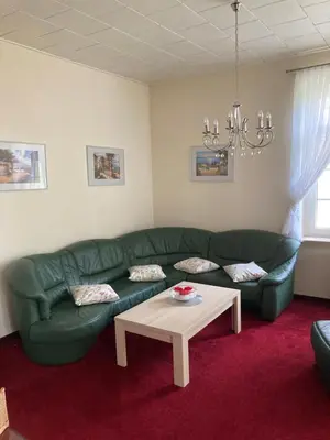 Ein Sitzbereich in der Unterkunft Villa Rosengarten