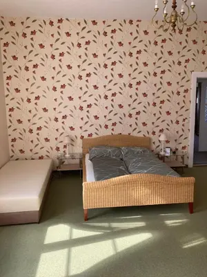 Ein Bett oder Betten in einem Zimmer der Unterkunft Villa Rosengarten