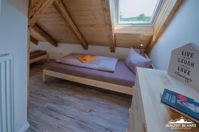 Ein Bett oder Betten in einem Zimmer der Unterkunft Auszeit im Harz - Haus 2 Wohnung 5
