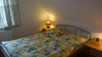 Ein Bett oder Betten in einem Zimmer der Unterkunft Ferienhaus Markgraf