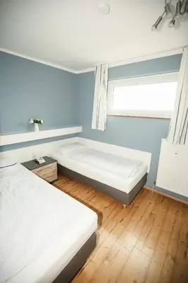 Ein Bett oder Betten in einem Zimmer der Unterkunft Harzherz, im Harz, mit Schwimmbad und Sauna