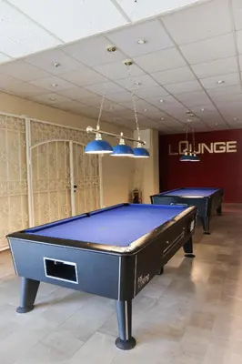 Eine Spielezimmer in der Unterkunft Harzherz, im Harz, mit Schwimmbad und Sauna