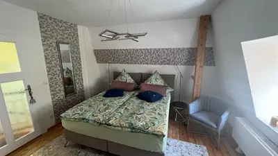 Ein Bett oder Betten in einem Zimmer der Unterkunft Roßtrappenblick