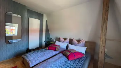Ein Bett oder Betten in einem Zimmer der Unterkunft Roßtrappenblick