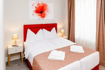 Ein Bett oder Betten in einem Zimmer der Unterkunft Aneton Garni Hotel