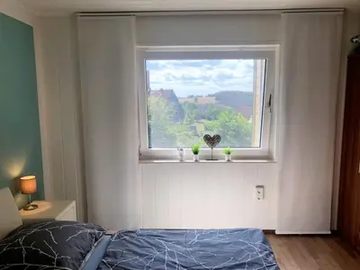 Ein Bett oder Betten in einem Zimmer der Unterkunft Ferienwohnung Bergblick in Sankt Andreasberg