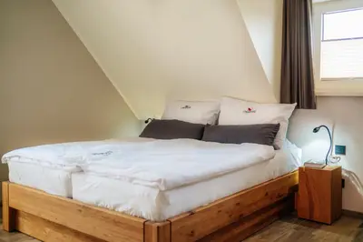 Ein Bett oder Betten in einem Zimmer der Unterkunft Baude III