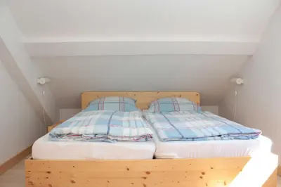 Ein Bett oder Betten in einem Zimmer der Unterkunft Ferienwohnung Forsthaus am Brocken, 55 qm, 2 Schlafzimmer F7