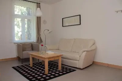 Ein Sitzbereich in der Unterkunft Ferienwohnung Forsthaus am Brocken, 40 qm, 1 Schlafzimmer F2