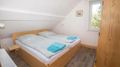 Ein Bett oder Betten in einem Zimmer der Unterkunft Ferienwohnung Forsthaus am Brocken, 60 qm, 3 Schlafzimmer F5