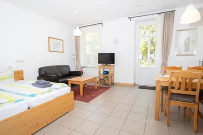 Ein Bett oder Betten in einem Zimmer der Unterkunft Ferienwohnung Forsthaus am Brocken, 35 qm, 1 Wohn-Schlafzimmer F1
